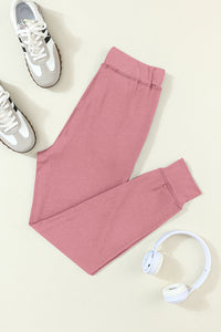 Fuchsiafarbene Jogginghose mit Kordelzug an der Taille und Taschen